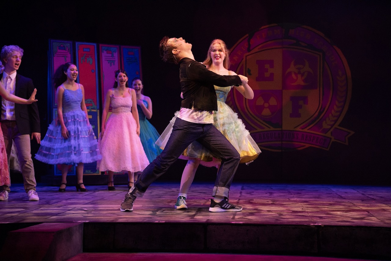 Students performing in Beetlejuice JR on stage
