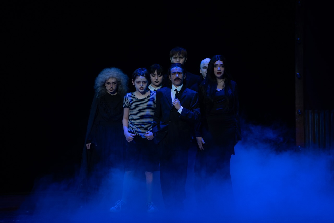 Academy cast in a dramatic ensemble scene